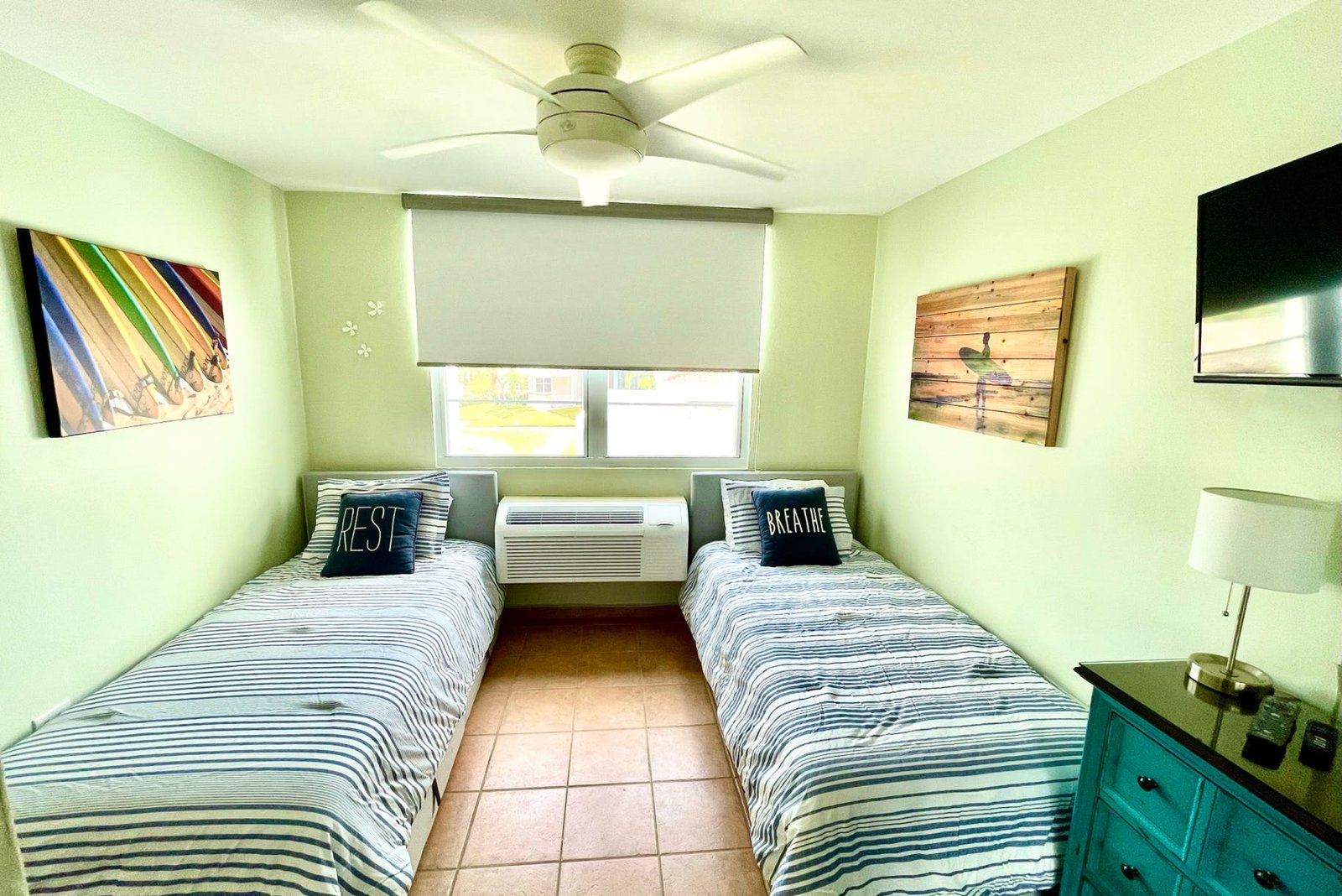 Twin Bedroom with AC, smart TV and Bluetooth speaker.