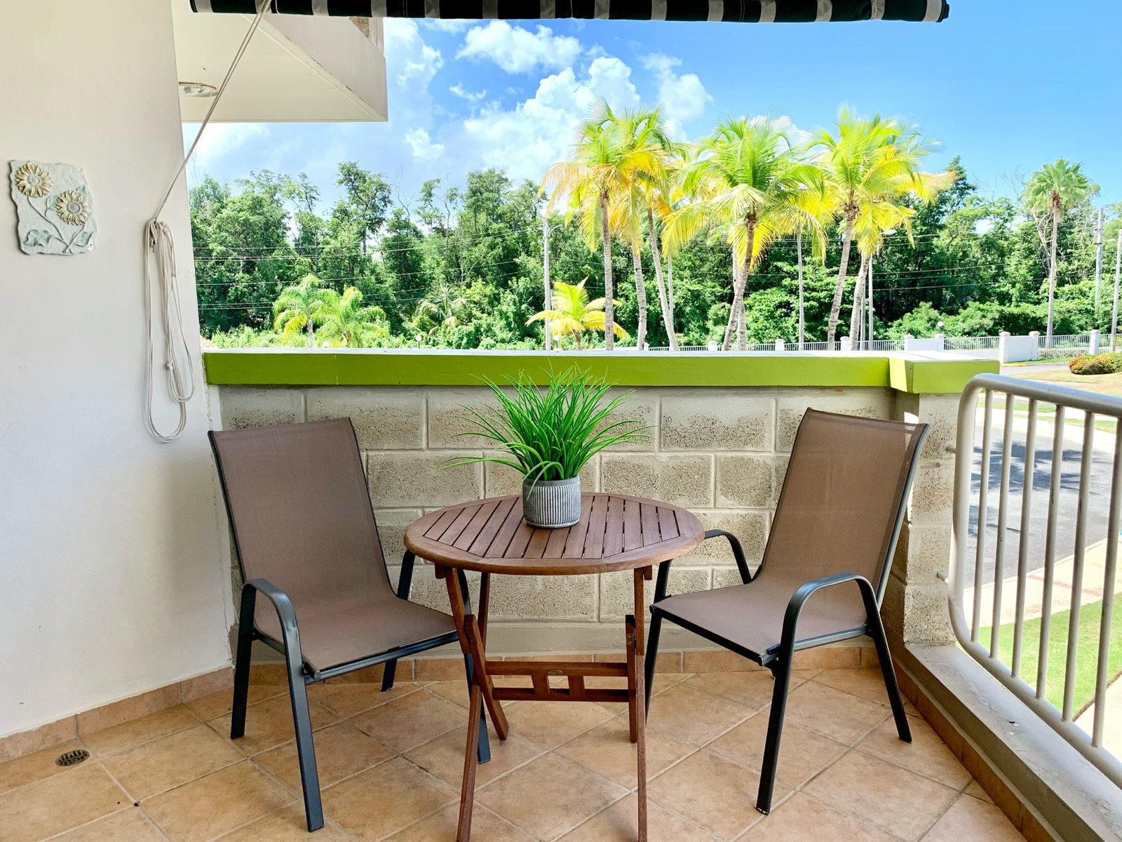 Breezy tropical view balcony at Rainforest Beach Condo